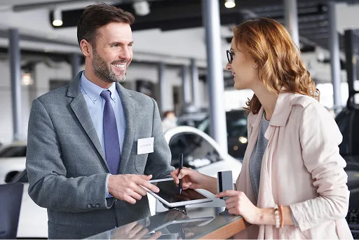 Automotive service desk issuing a parts and labour invoice